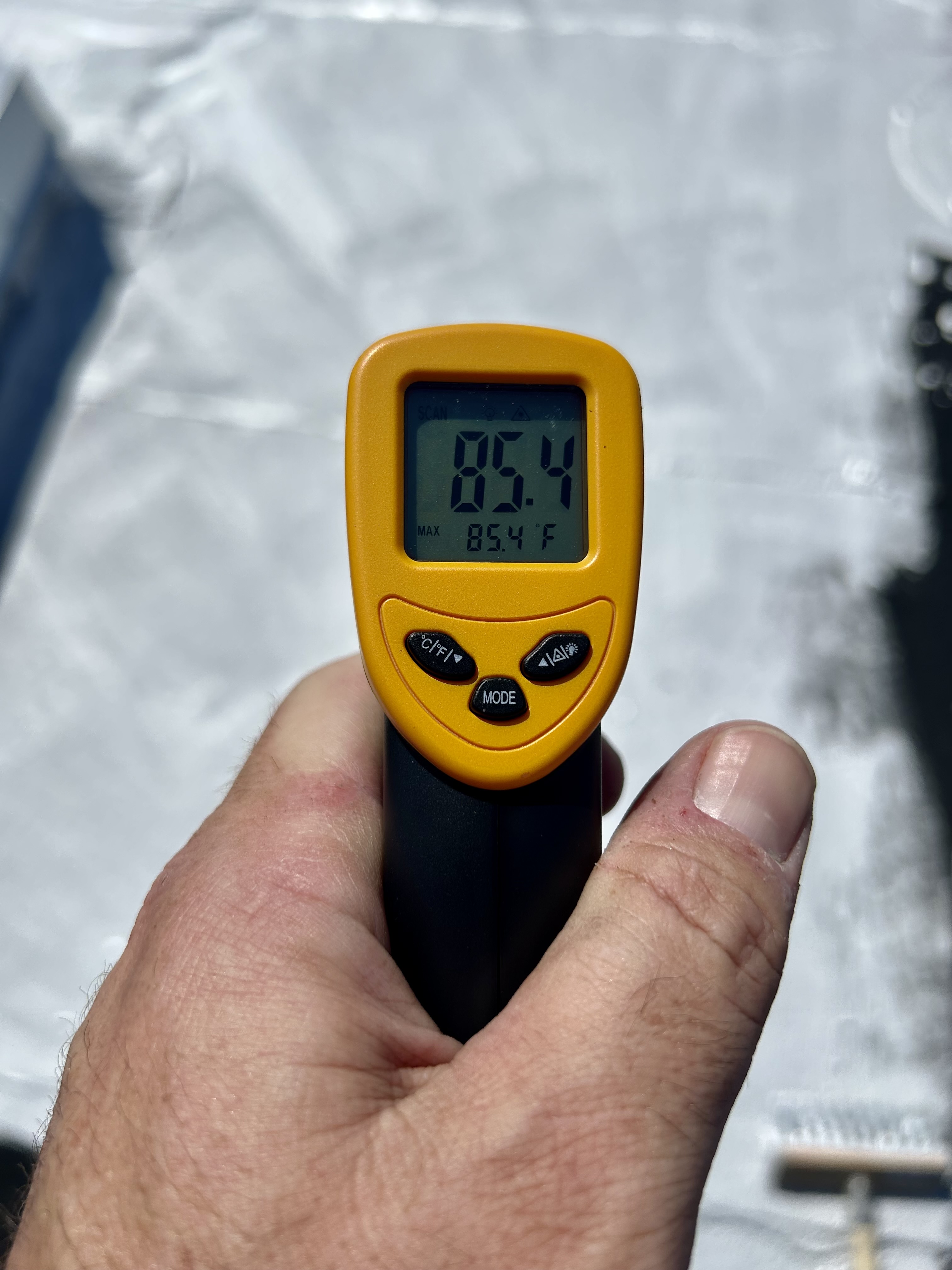 Thermometer reading of aluminum coated roof